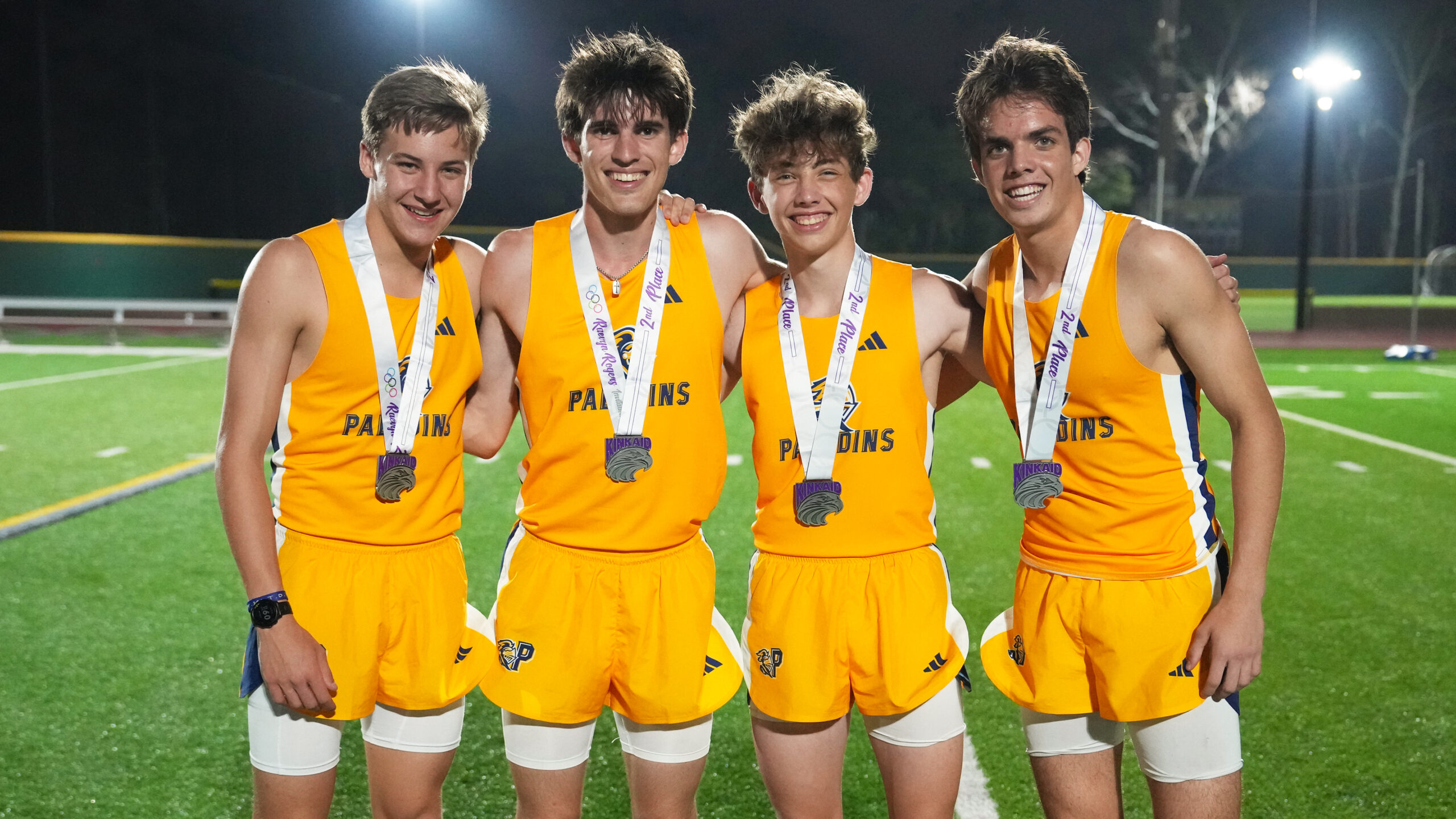 Providence Classical School Varsity Boys Track athletes with medals