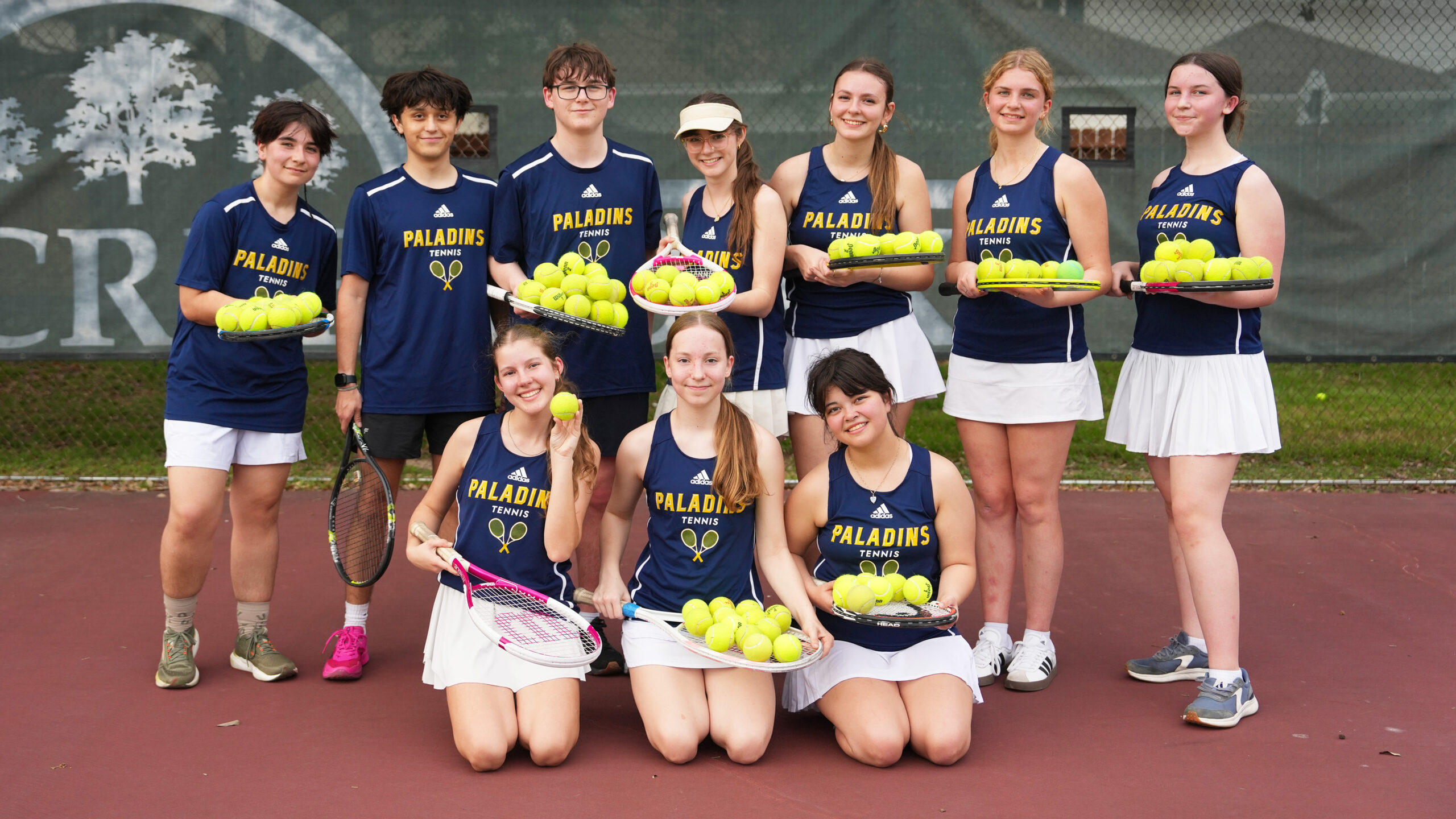 Providence Classical School Varsity Tennis cute group shot with tennis balls