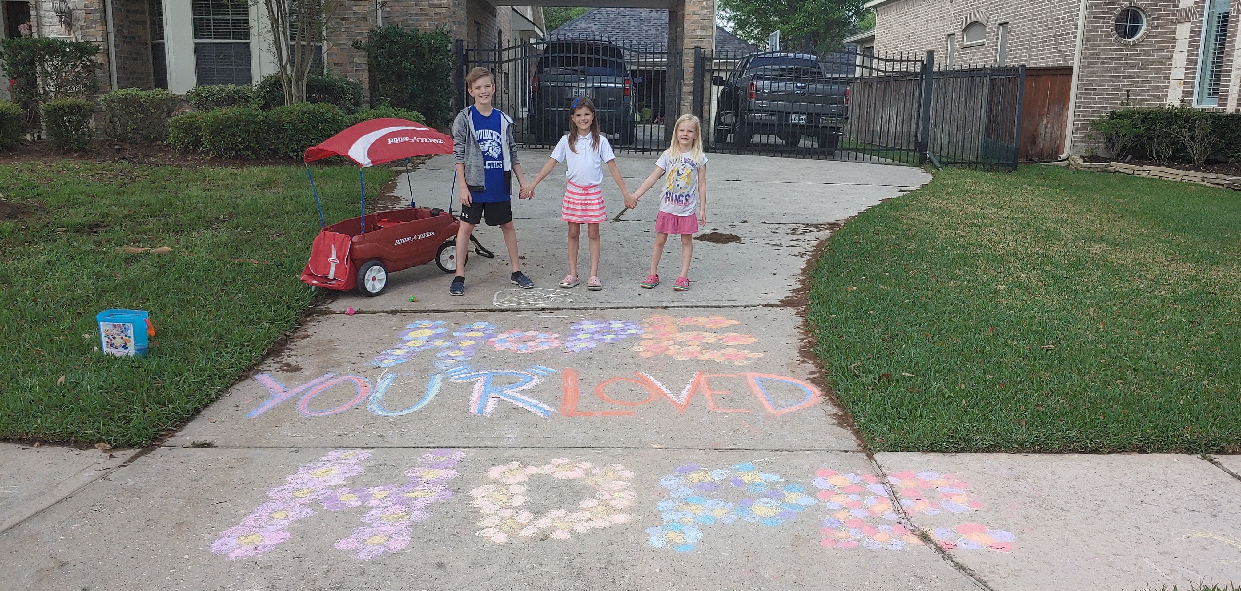 PCS family chalking their driveway to spread cheer during COVID-19 Coronavirus social distancing.