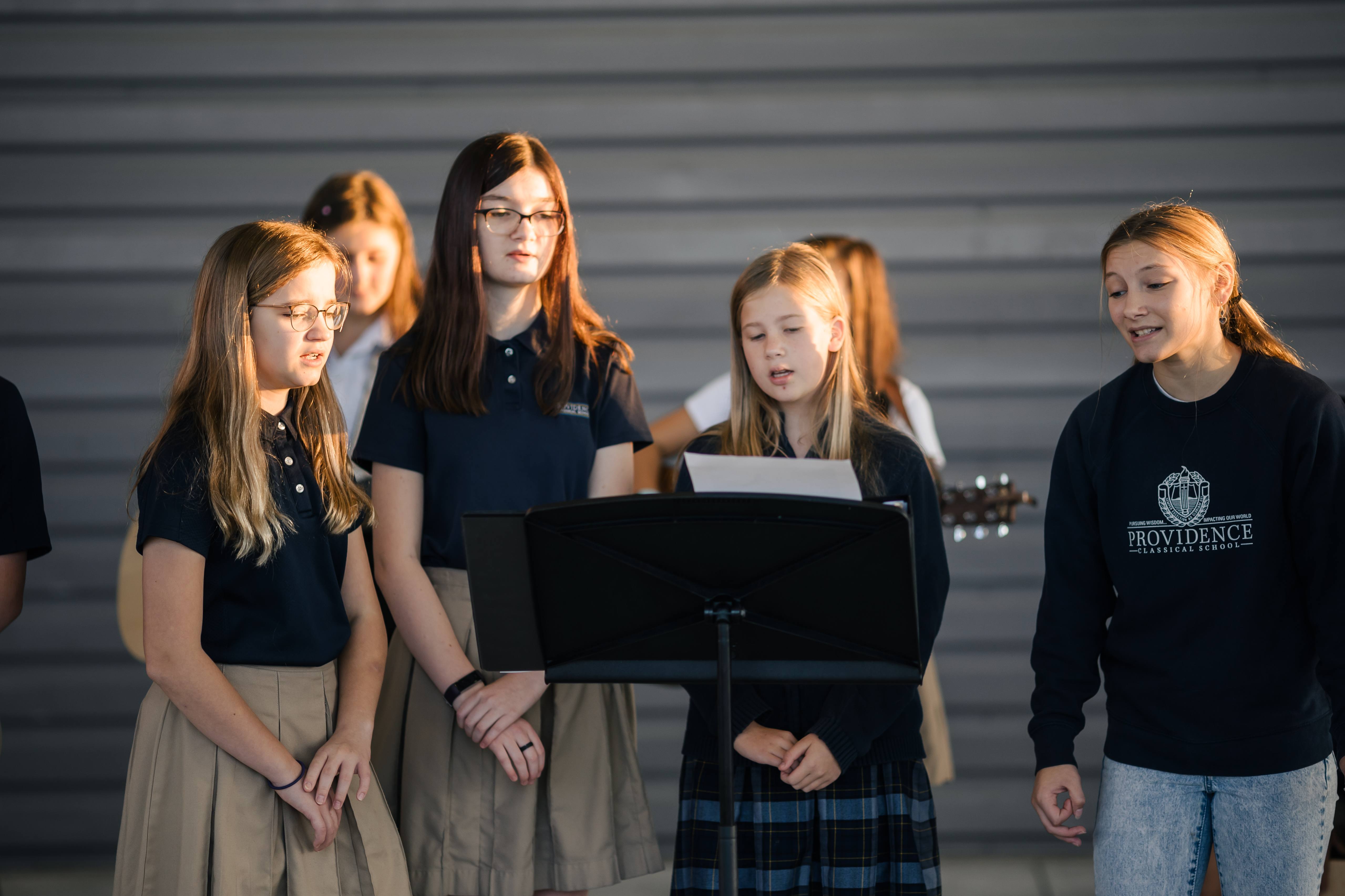 Providence Classical School Worship Team leading students in Christian praise songs.