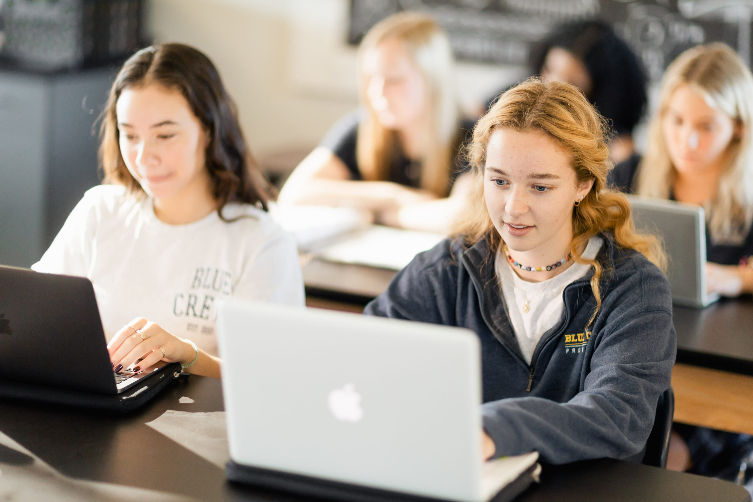 High school students using laptops at Providence Classical School