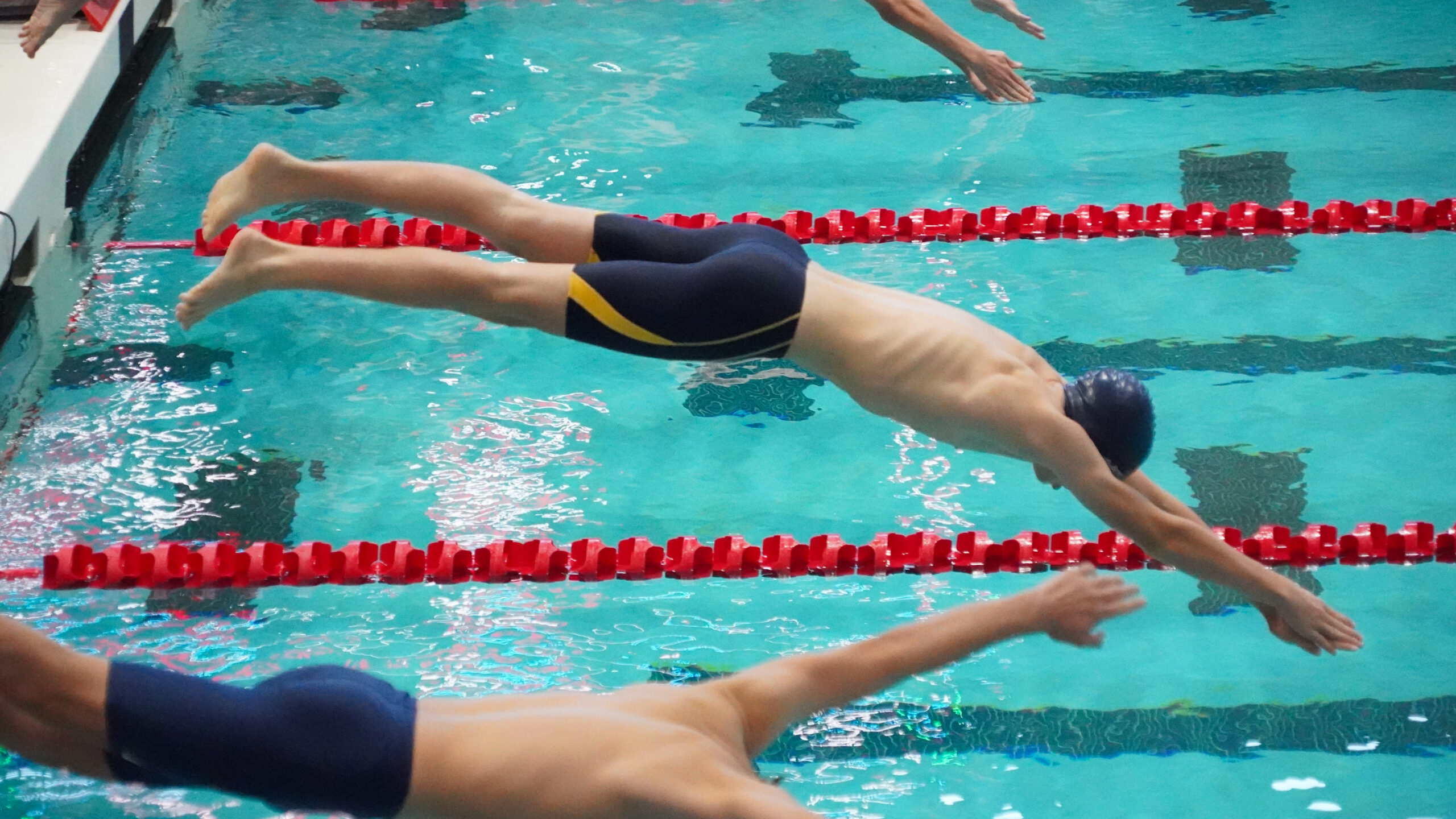 Providence Classical School swimmer diving into the water
