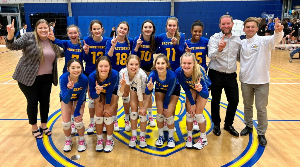 Providence Classical School Varsity Volleyball team posing as District Champions