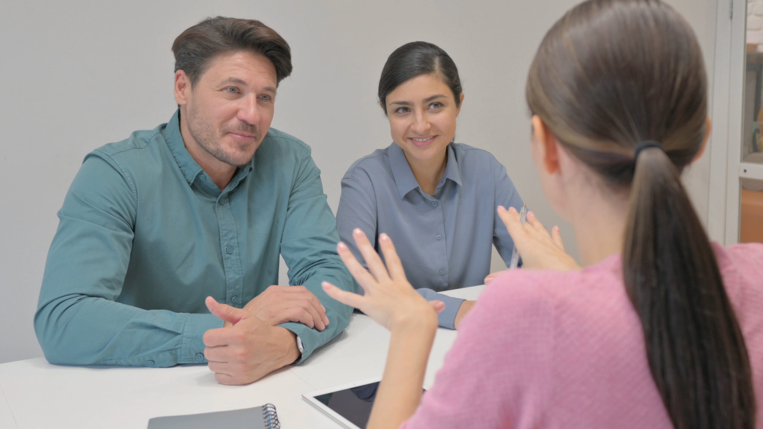 Teenager talking with parents about how to pay for college