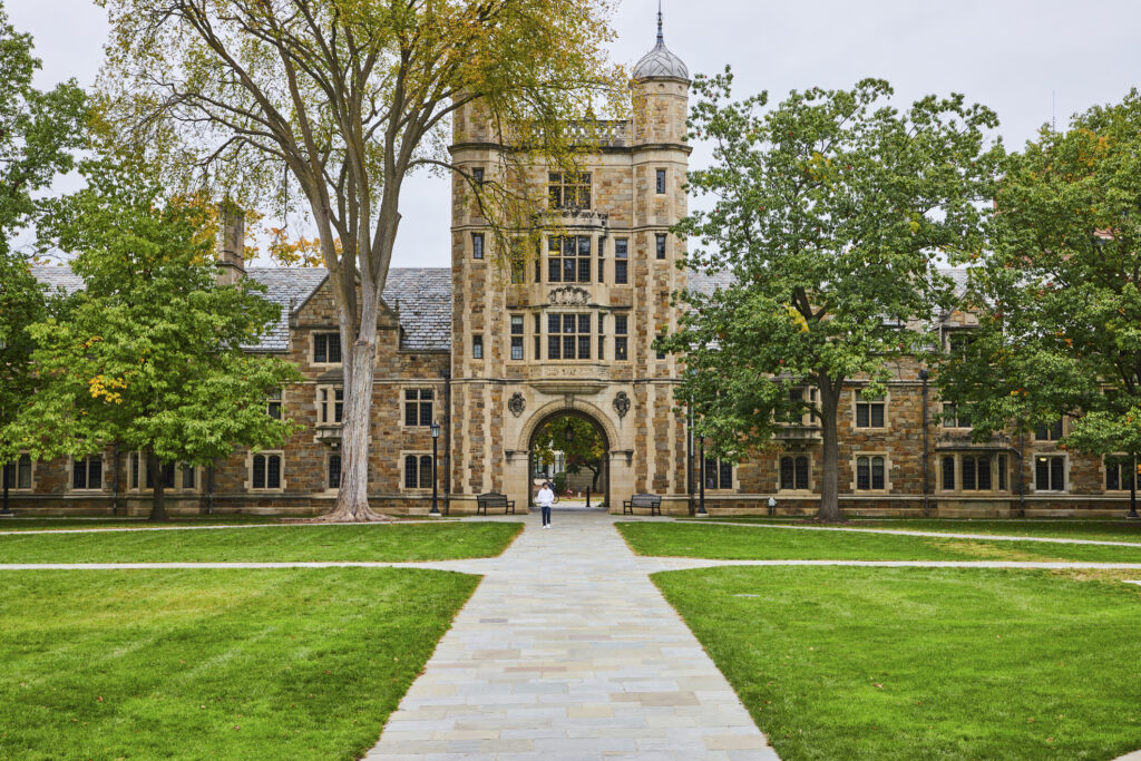 Gothic University Building, Lush Campus Pathway, Autumn Leaves